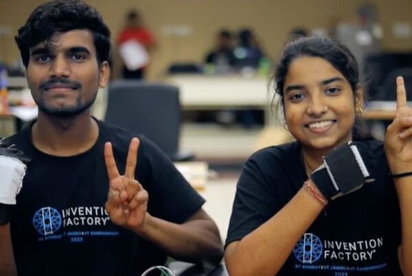 Aditya and Nivedta wearing Vibration Dampening Gloves. Students from Invention Factory showcasing their prototype.